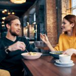 cheerful young couple communication restaurant leisure lifestyle
